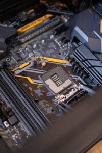 pexels-photo-2582937-2582937 Detailed view of a computer motherboard highlighting electronic components and technology connections.